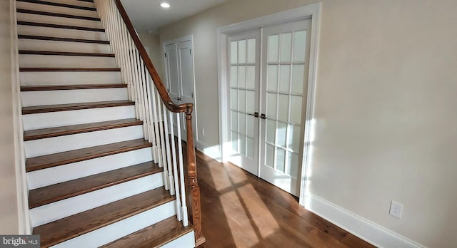 stairs with hardwood / wood-style flooring