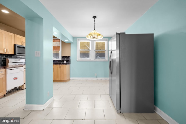 kitchen featuring decorative backsplash, light brown cabinets, and stainless steel appliances