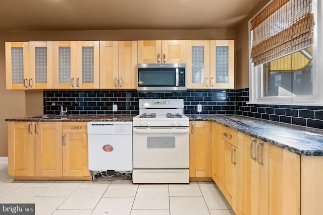 kitchen featuring light brown cabinets, white appliances, backsplash, and light tile patterned floors