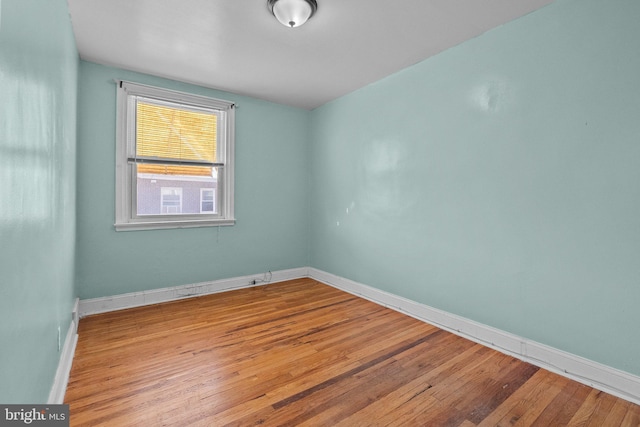 unfurnished room with light hardwood / wood-style floors