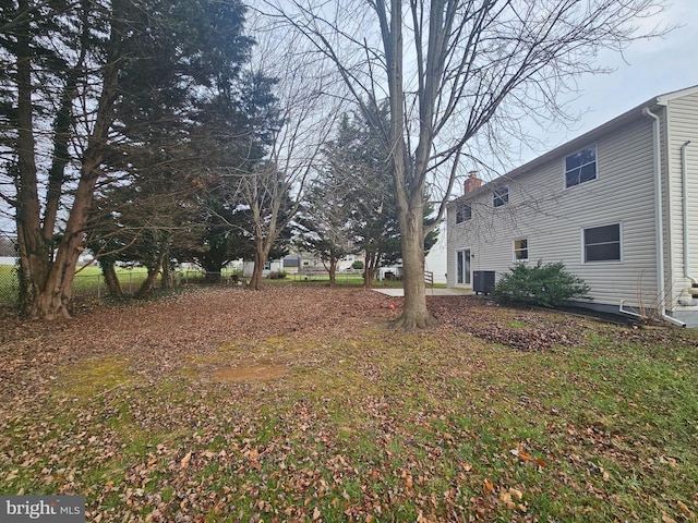 view of yard with central air condition unit