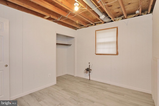 basement featuring light wood-type flooring