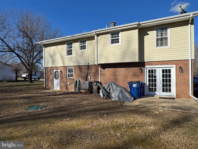 rear view of property featuring french doors