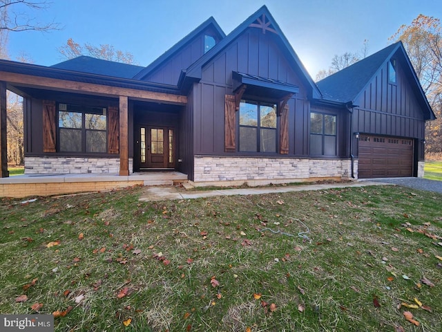 view of front of home with a garage and a front yard