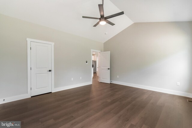 interior space with dark hardwood / wood-style floors, high vaulted ceiling, and ceiling fan