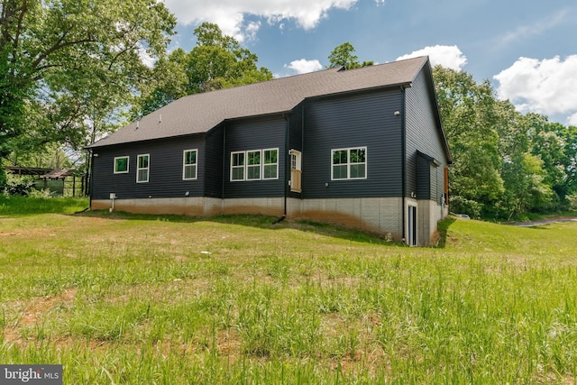 view of home's exterior with a yard