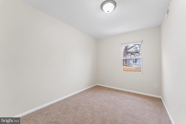 empty room featuring carpet floors