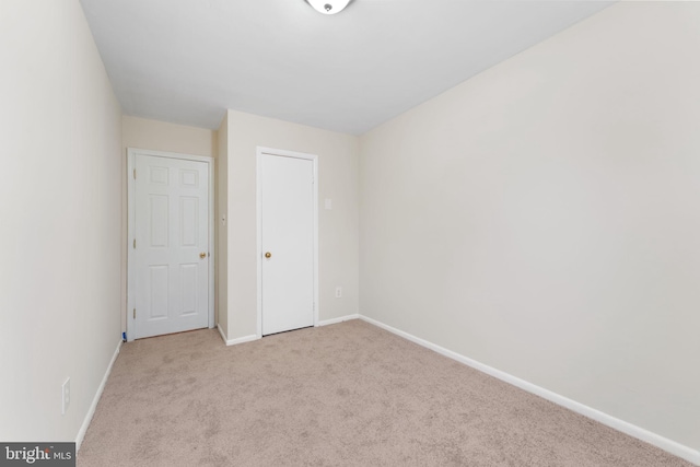 unfurnished bedroom with light carpet