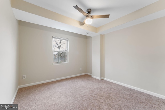 empty room featuring carpet flooring and ceiling fan