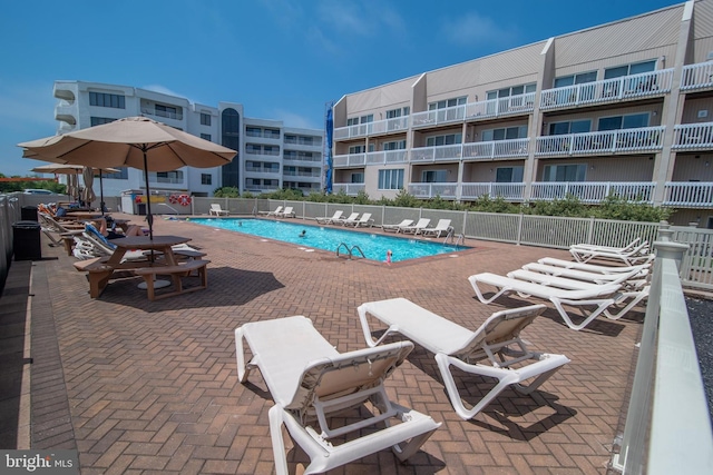 view of swimming pool with a patio area