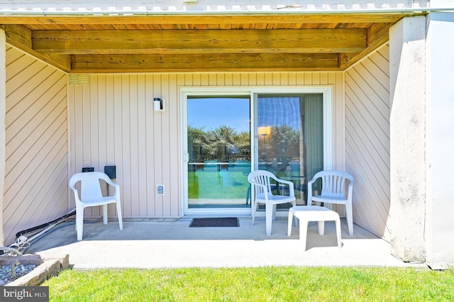 property entrance with a patio