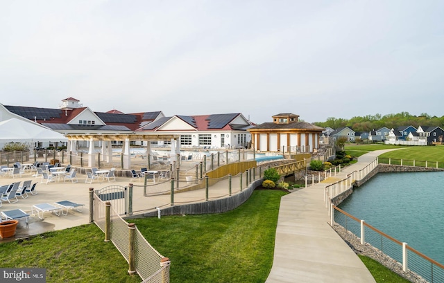 exterior space with a yard and a water view