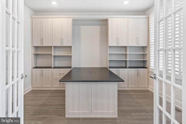 kitchen featuring french doors, dark hardwood / wood-style flooring, and light brown cabinetry