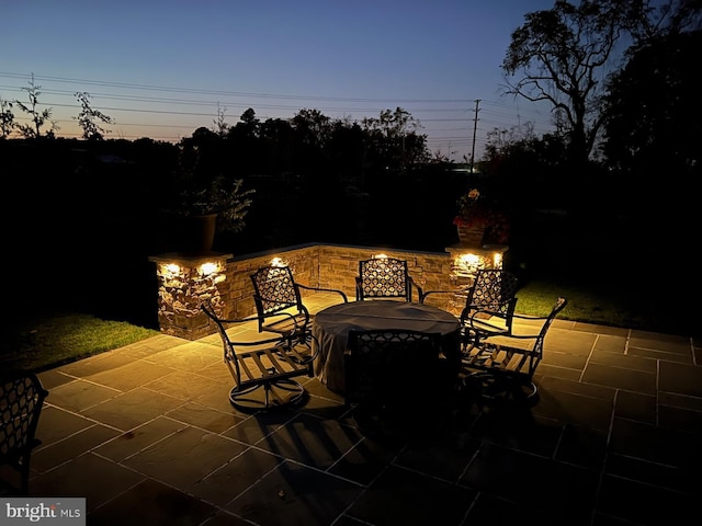 view of patio terrace at dusk