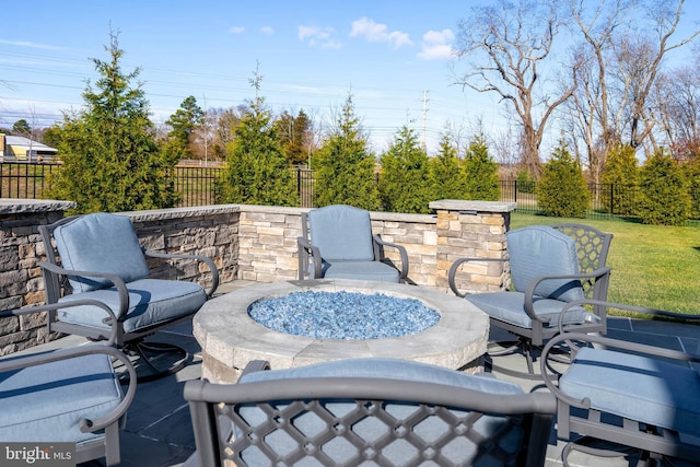 view of patio / terrace featuring an outdoor fire pit