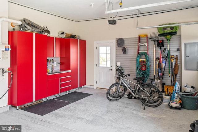 garage featuring electric panel and a garage door opener