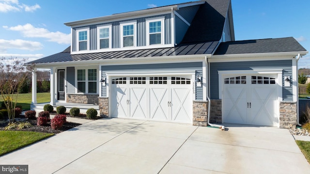 view of front of property with a porch and a garage