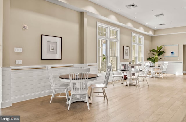 dining area with light hardwood / wood-style floors