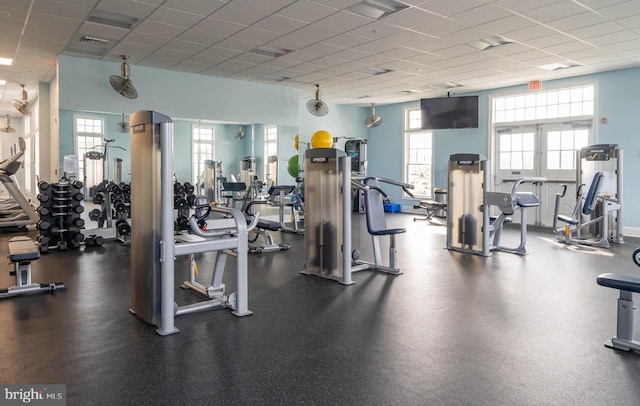 exercise room featuring a paneled ceiling