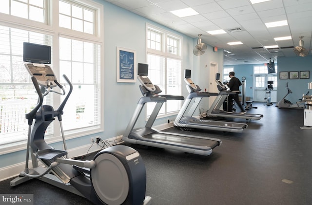 workout area with a paneled ceiling