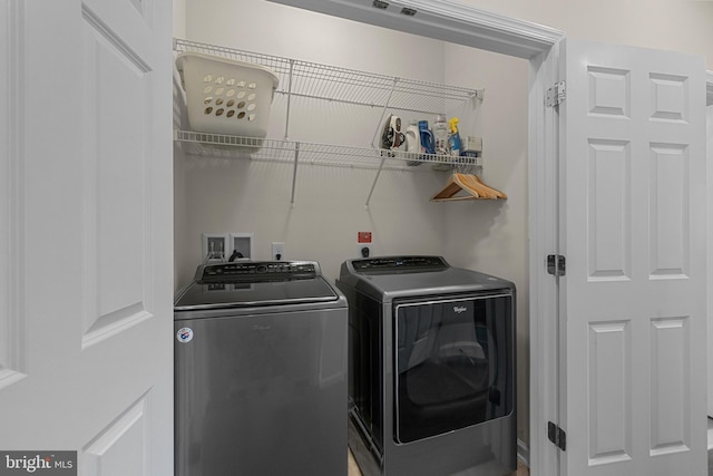 washroom with washer and clothes dryer