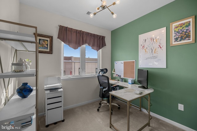 home office featuring light carpet and a chandelier