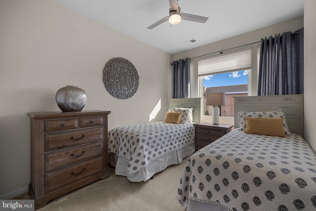 bedroom with light colored carpet and ceiling fan