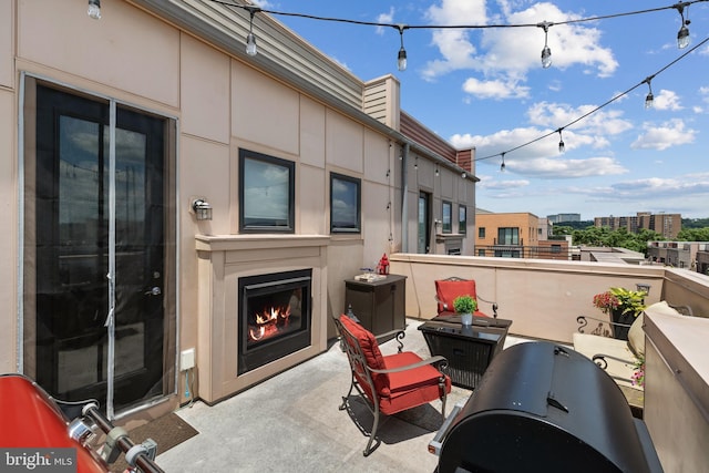 view of patio / terrace with exterior fireplace