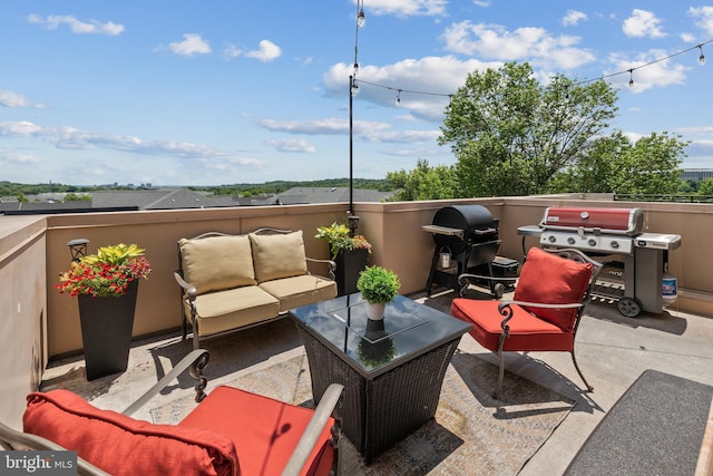 view of patio with a grill, a balcony, and an outdoor hangout area