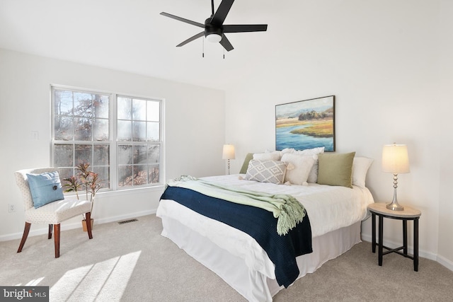 bedroom with light carpet and ceiling fan