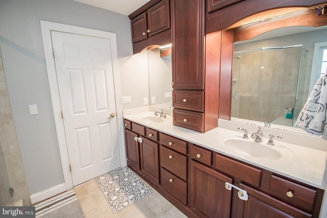 bathroom with tile patterned flooring, vanity, and an enclosed shower