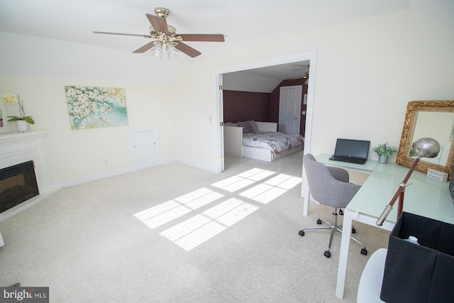 office area featuring light colored carpet, ceiling fan, and lofted ceiling