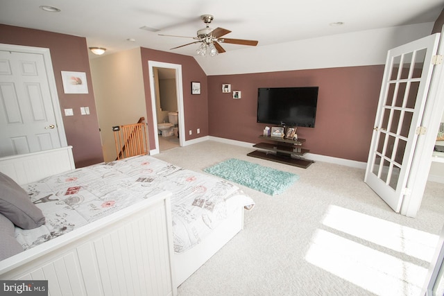 carpeted bedroom with ceiling fan and ensuite bathroom