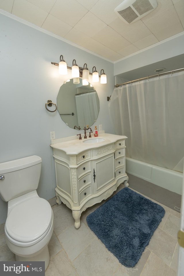 bathroom featuring ornamental molding, toilet, tile patterned flooring, and vanity