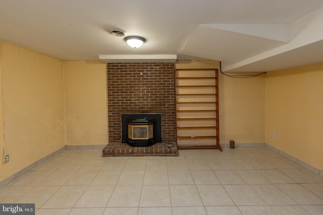 unfurnished living room featuring a wood stove