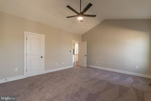 unfurnished bedroom with carpet, ceiling fan, and vaulted ceiling