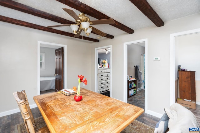 dining space with beamed ceiling, dark hardwood / wood-style flooring, a textured ceiling, and ceiling fan