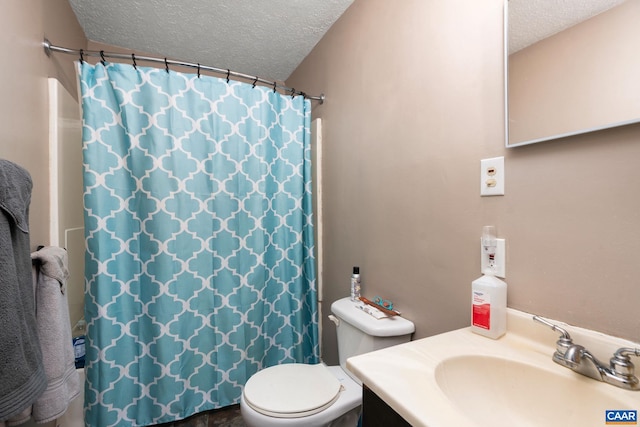 bathroom featuring a shower with curtain, vanity, a textured ceiling, and toilet