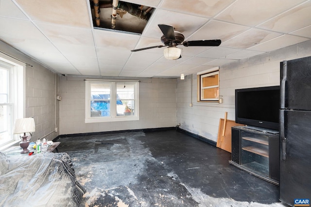 interior space featuring ceiling fan and a healthy amount of sunlight