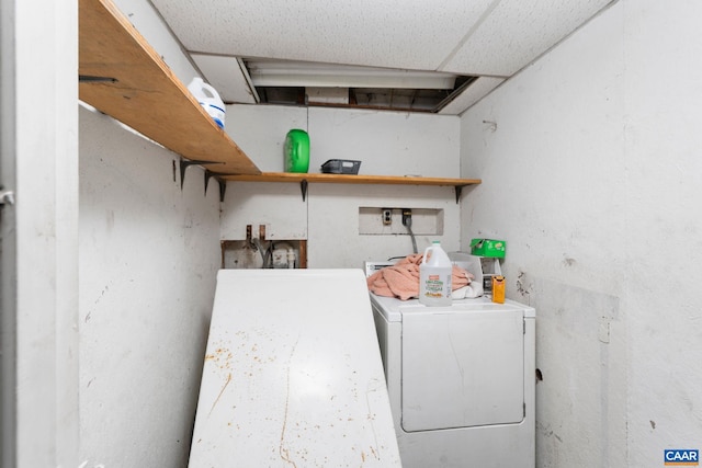 clothes washing area featuring washer / clothes dryer