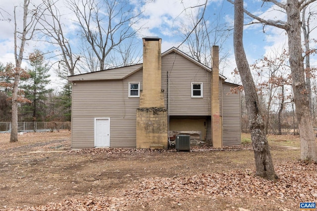 rear view of property featuring central air condition unit