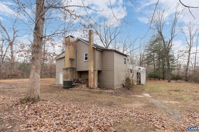 view of property exterior with central AC