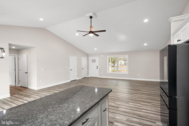 kitchen with white cabinetry, refrigerator, light hardwood / wood-style floors, and ceiling fan