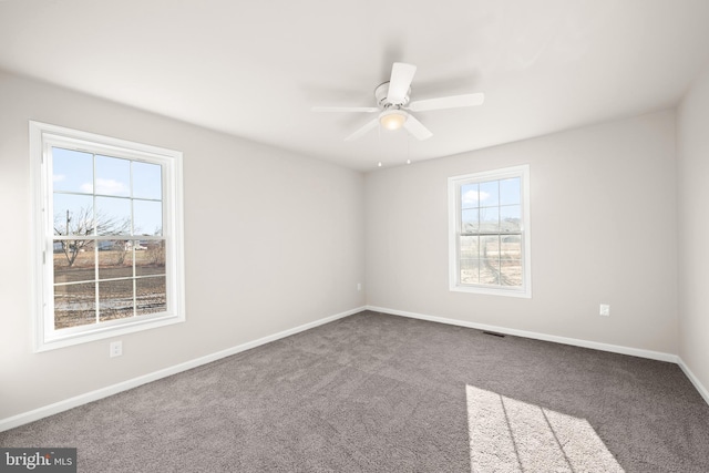 unfurnished room featuring carpet flooring and ceiling fan