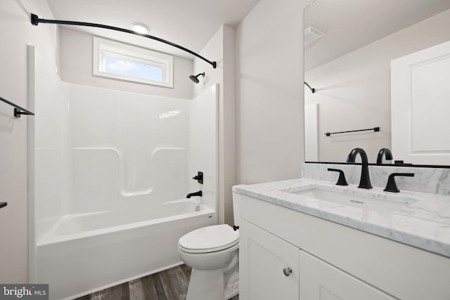 full bathroom featuring shower / bathing tub combination, vanity, toilet, and wood-type flooring