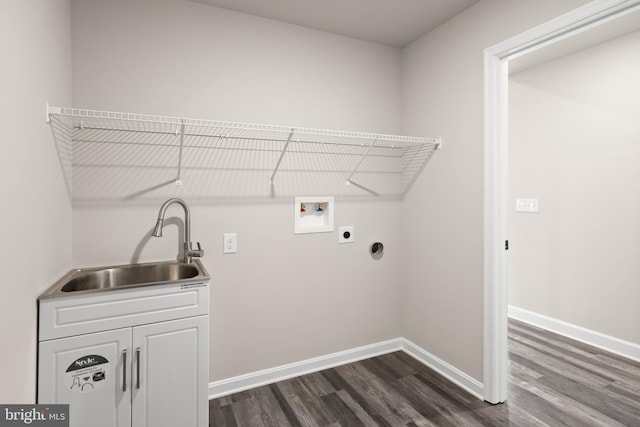 laundry room with hookup for an electric dryer, hookup for a washing machine, dark hardwood / wood-style flooring, cabinets, and sink