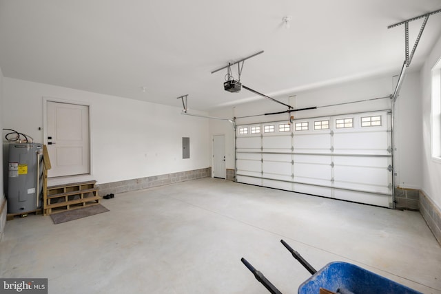 garage with electric water heater, electric panel, and a garage door opener