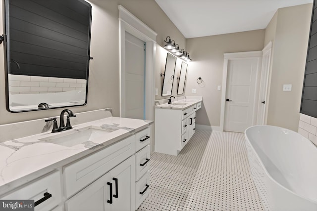 bathroom featuring a washtub and vanity