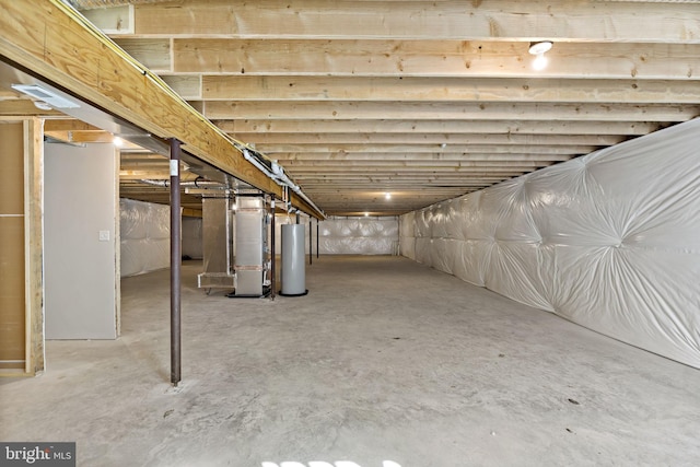 basement featuring heating unit and gas water heater