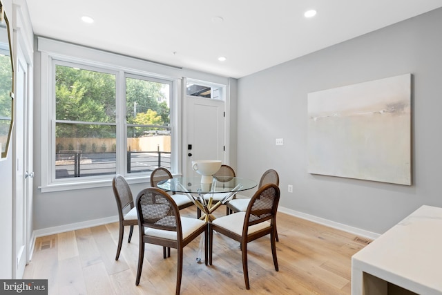 dining area with light wood-type flooring